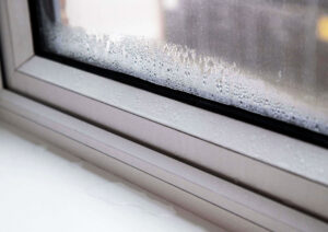 Closeup to condensation in your garden room and water on the inside of windows.